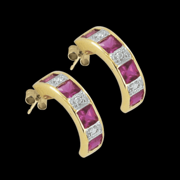 Six Brilliant Cut Diamonds Enclose a Square Ruby