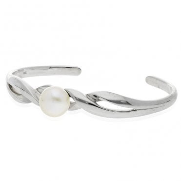 Twist-cuff bangle punctuated by a perfect pearl